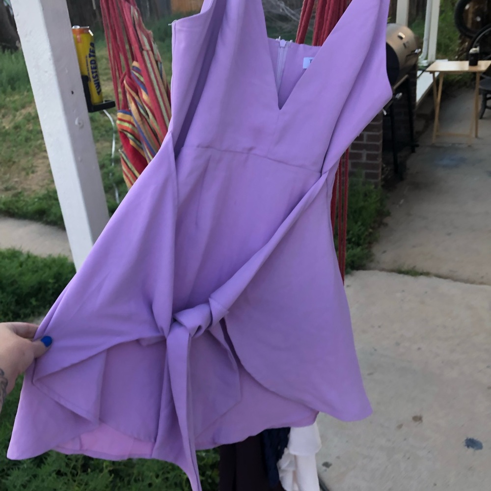 Tobi brand dress with flaps that can tie in the front or the back. Size L